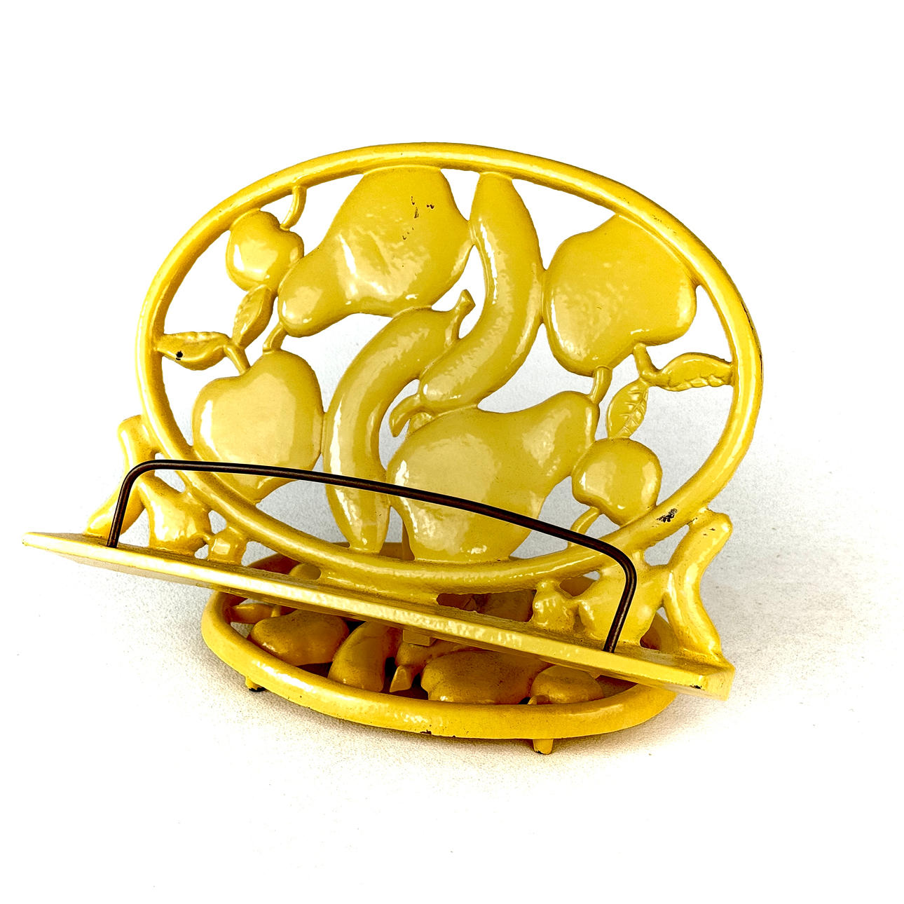 PAINTED CAST IRON BOOK STAND.