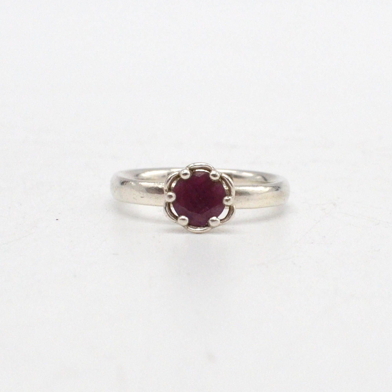 SPINNING JEWELRY, ROUND CUT RUBY RING, STERLING SILVER SETTING, DENMARK, SIZE NO. 14/54 MM.