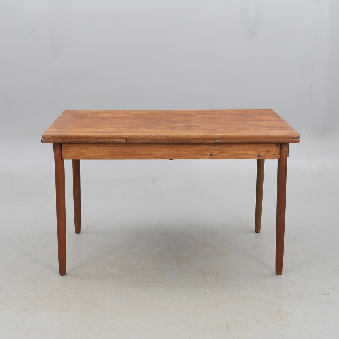 DINING TABLE, with two inserts, mid 20th century, teak.