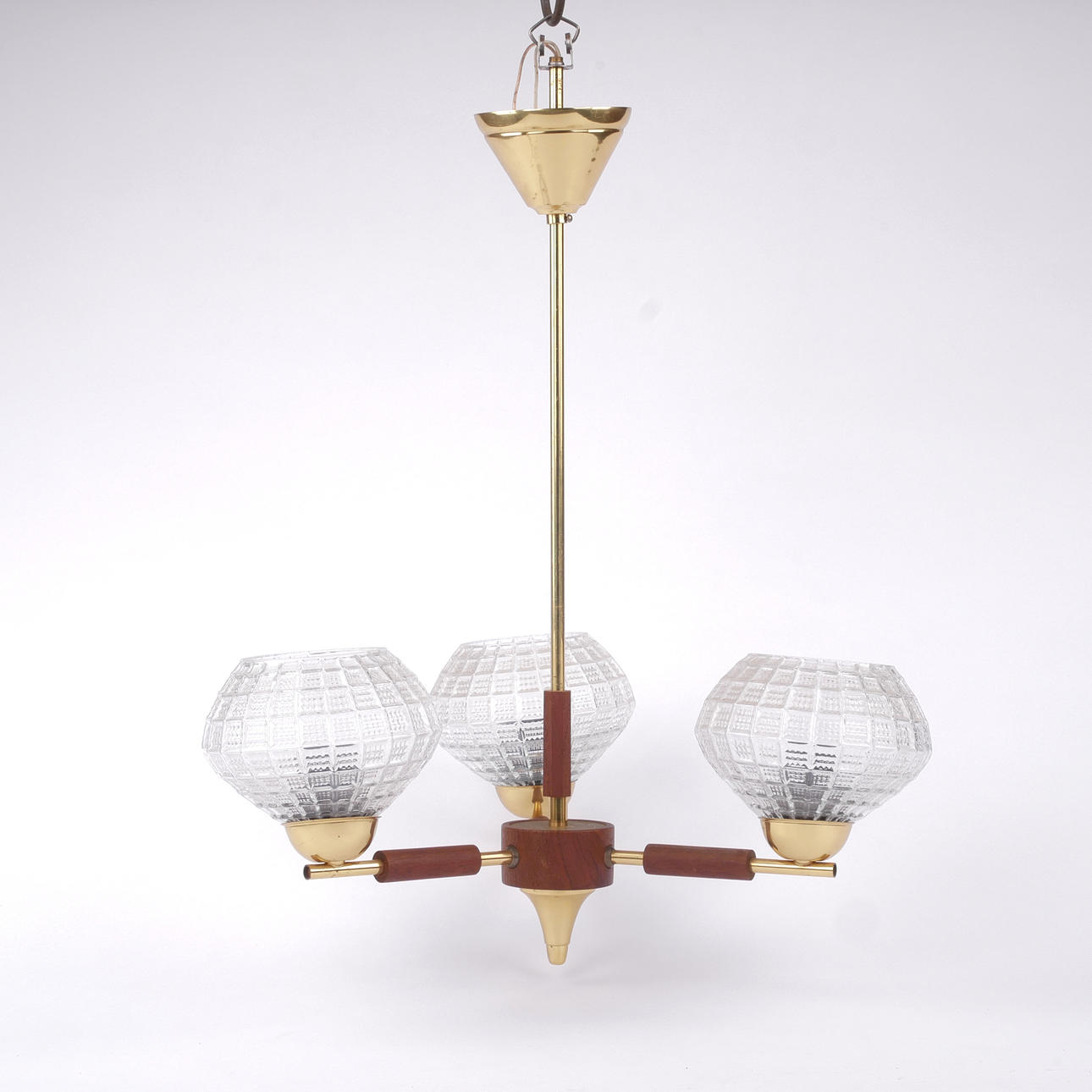 A three-arm teak and brass ceiling lamp, 1960s.
