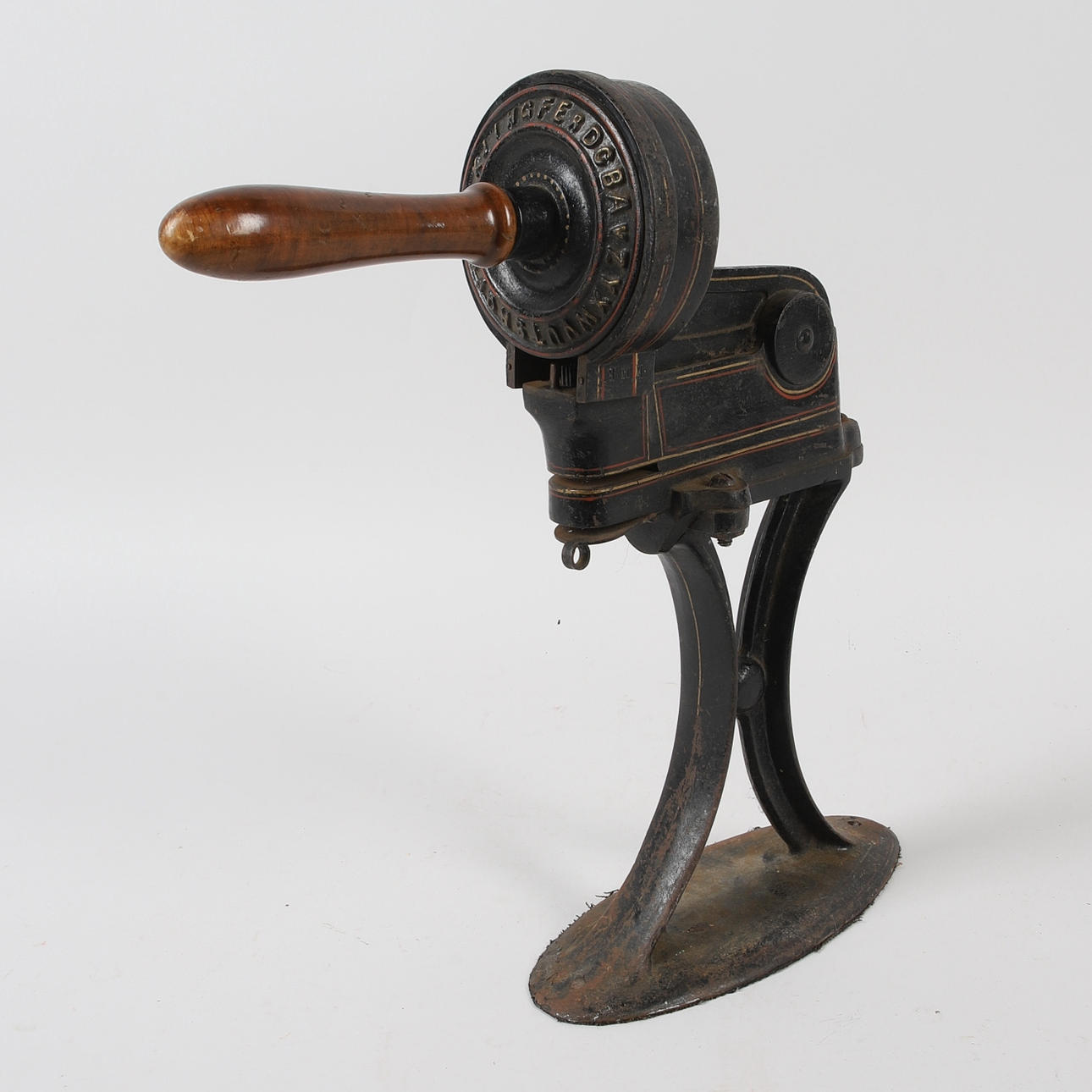 A cast iron embossing machine, early 20th century.