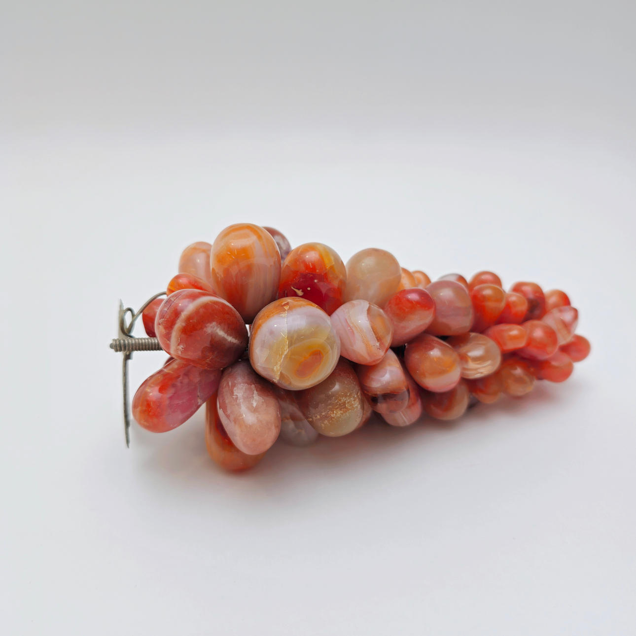 CLUSTER OF AGATE GRAPES AND METAL LEAF.