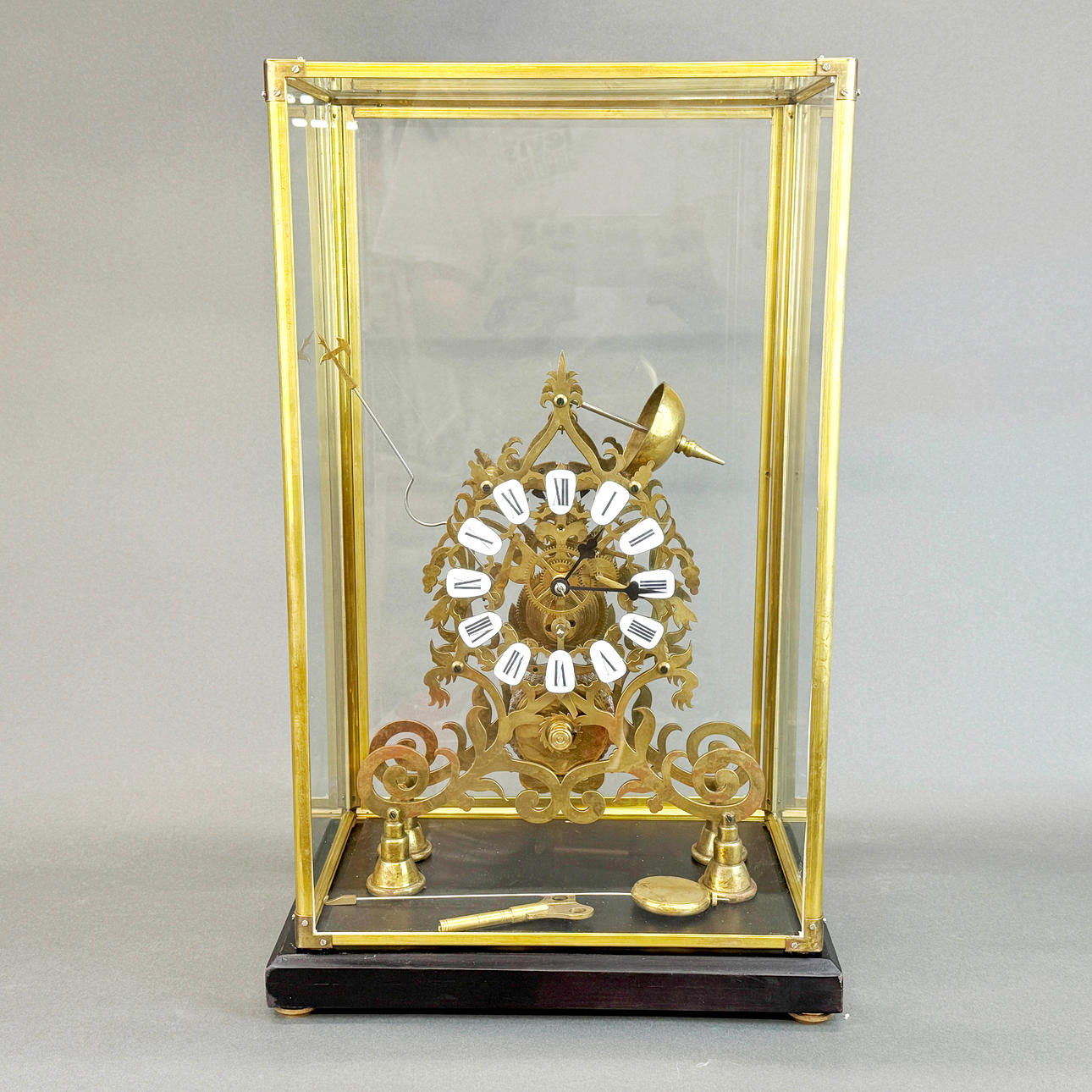 CASED BRASS SKELETON CLOCK.