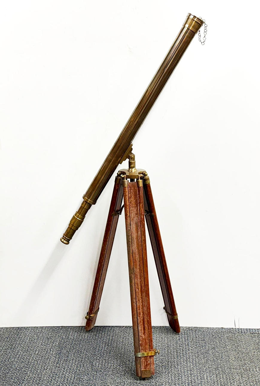 LARGE BRASS TELESCOPE ON A TRIPOD BASE.