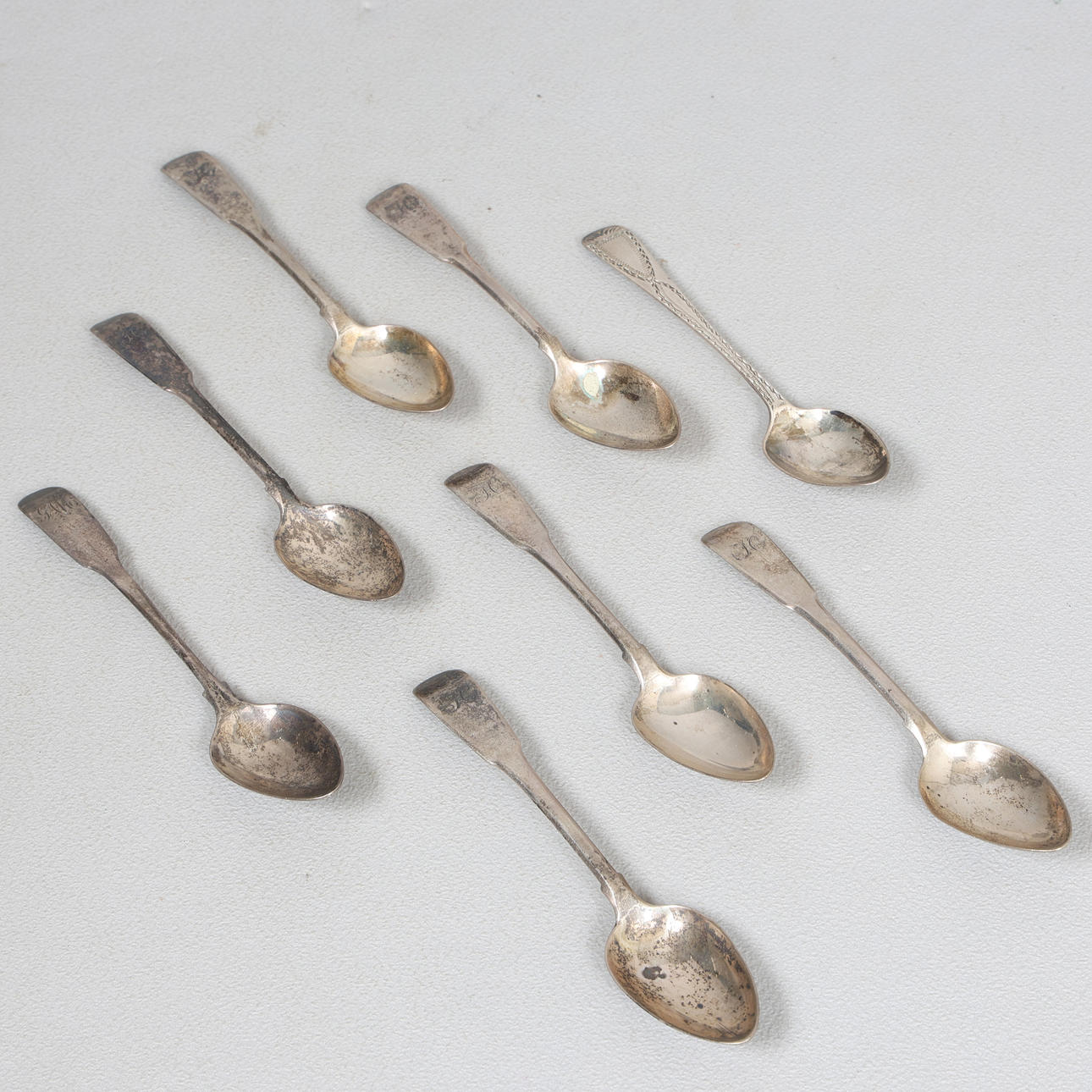 EIGHT GEORGE III NEWCASTLE SILVER TEASPOONS (8).