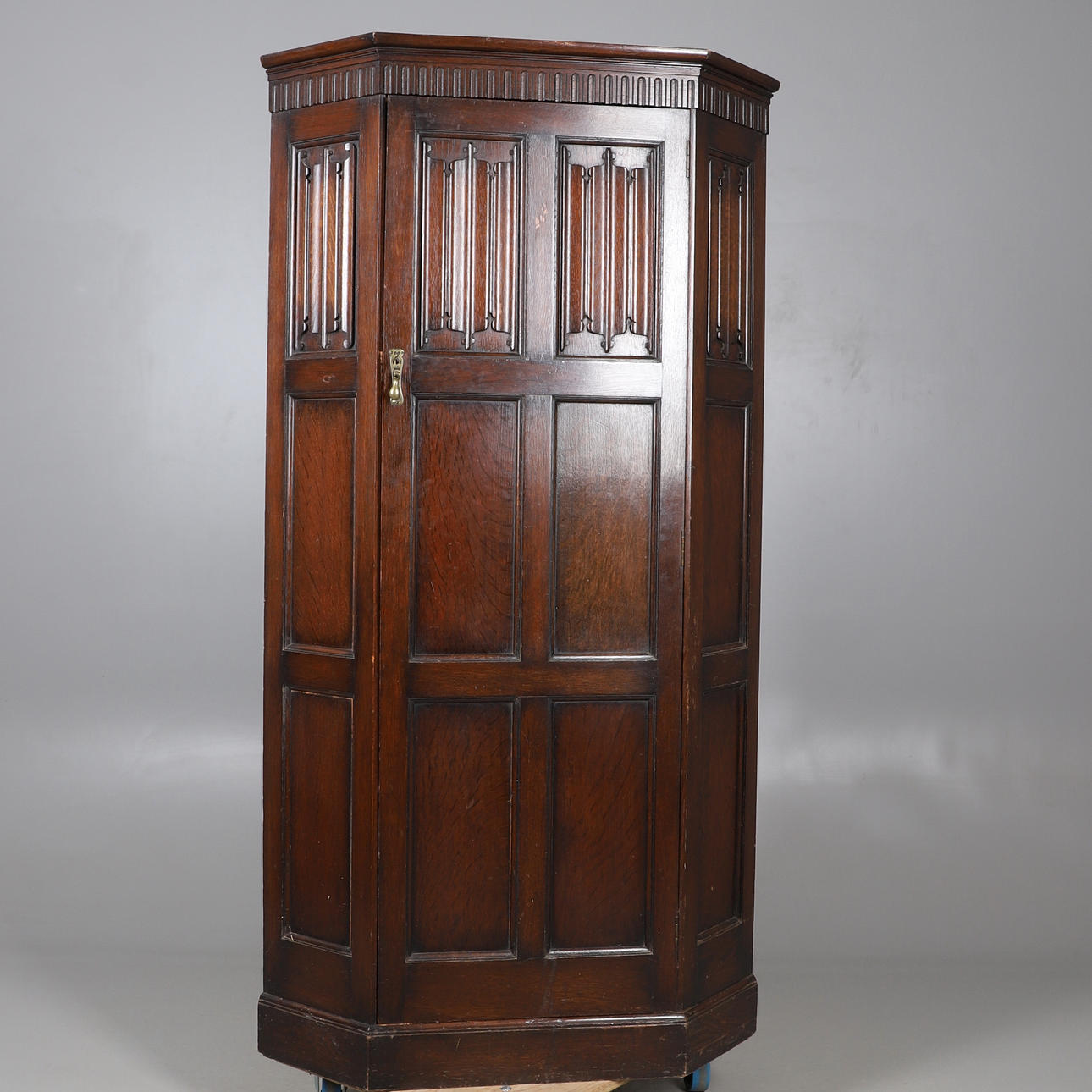 WARING & GILLOW - LARGE OAK CORNER CUPBOARD.