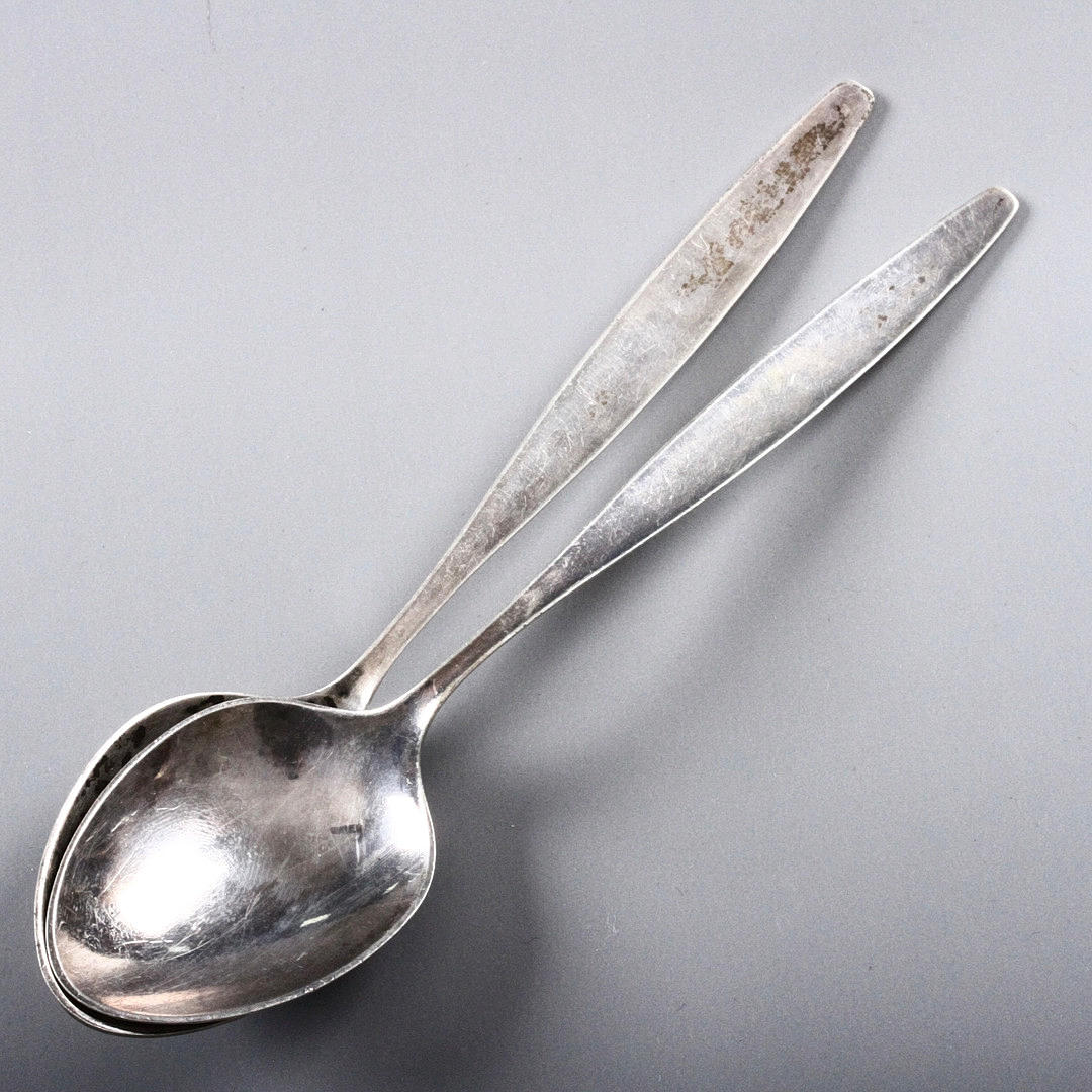 GEORG JENSEN. Two sterling silver “Cypress” tablespoons, Denmark.