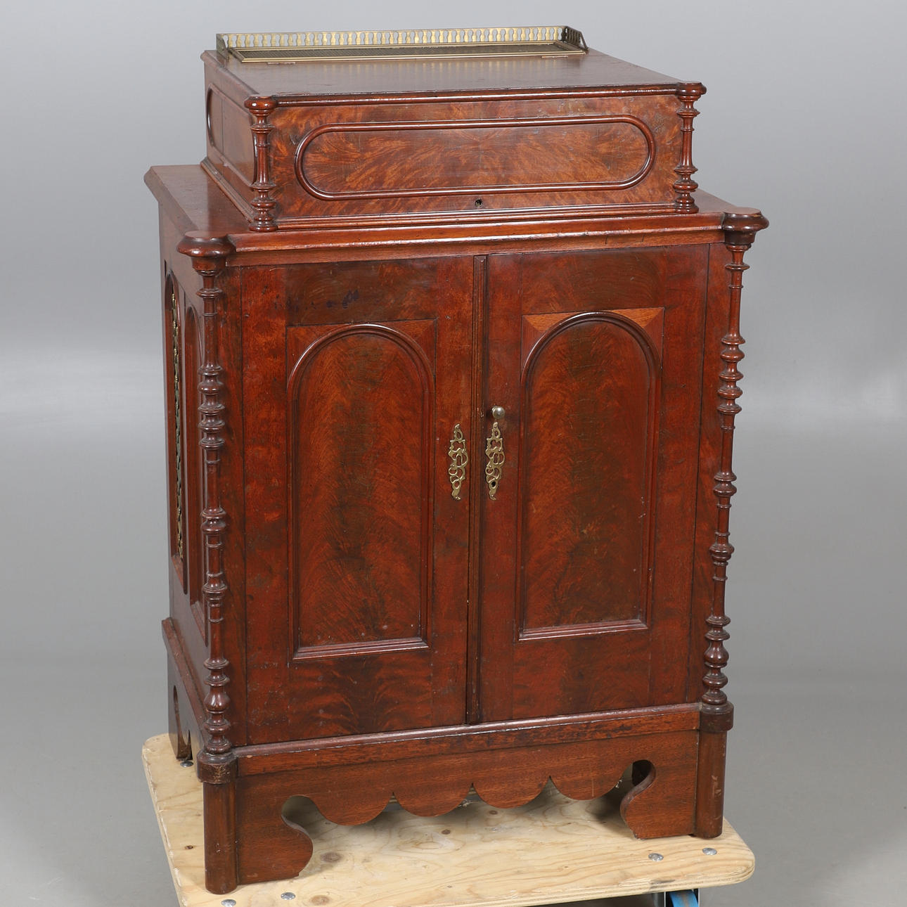 AN ANTIQUE MAHOGANY CABINET (CONVERTED).