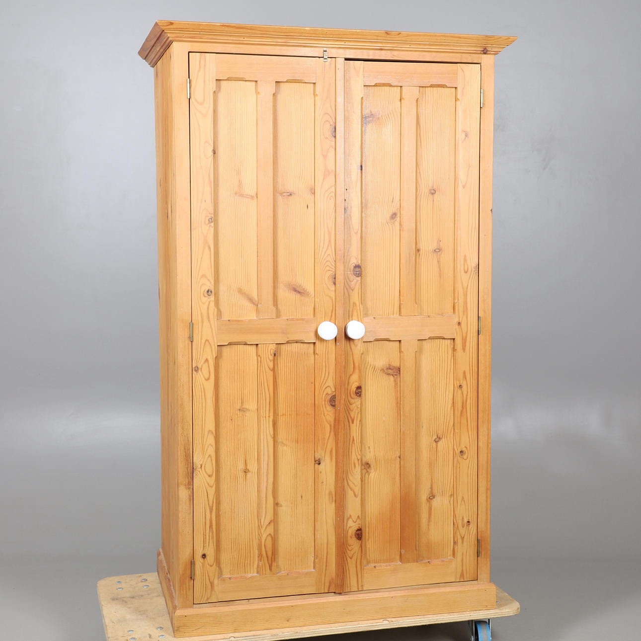 A DWARF PINE TWO DOOR WARDROBE.