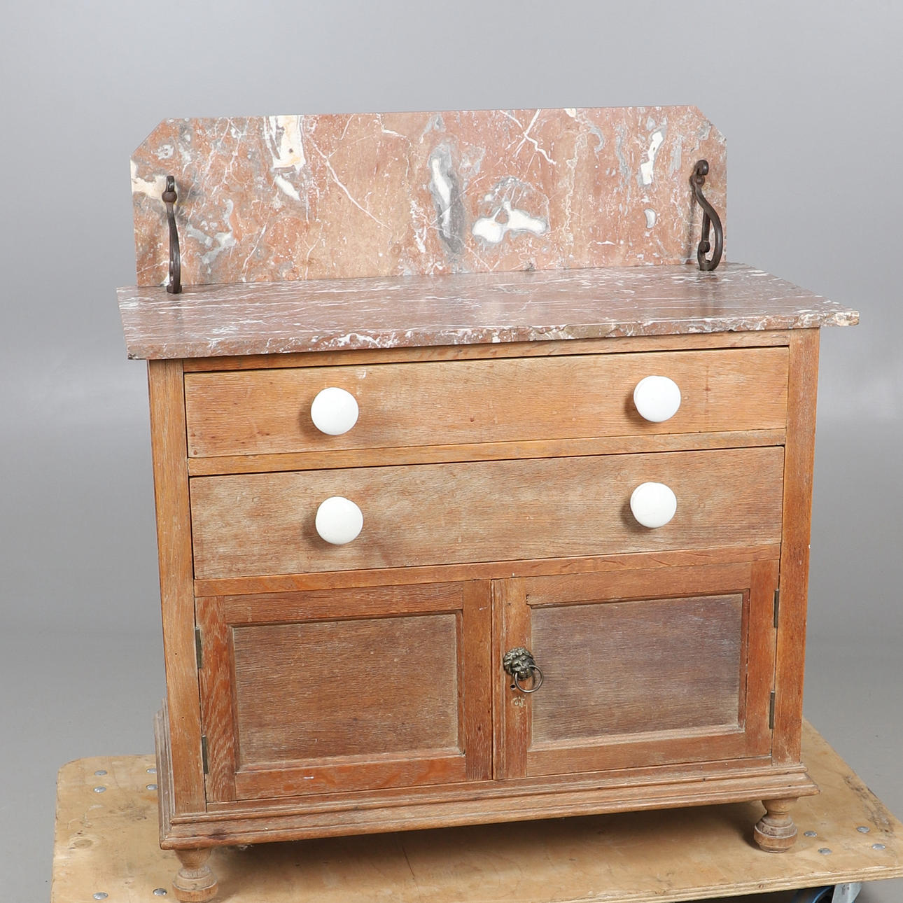 A MARBLE TOPPED PINE WASHSTAND/CHEST.