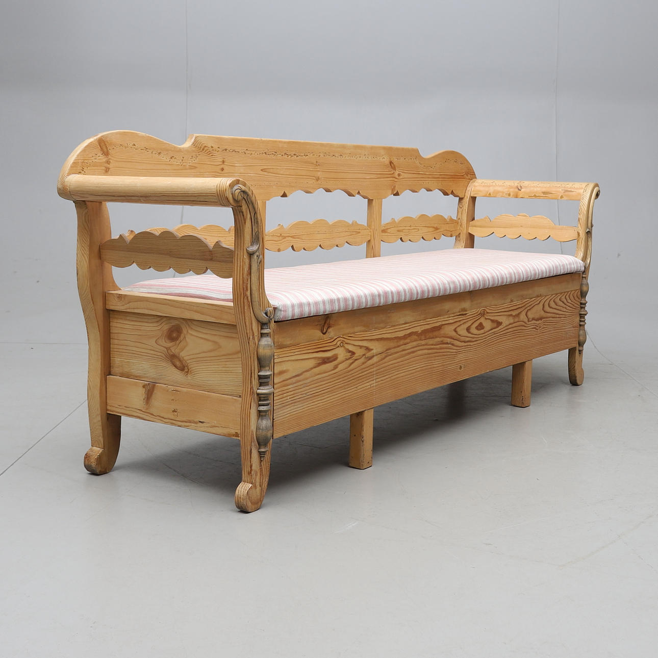A kitchen sofa, pine with storage, 20th century.