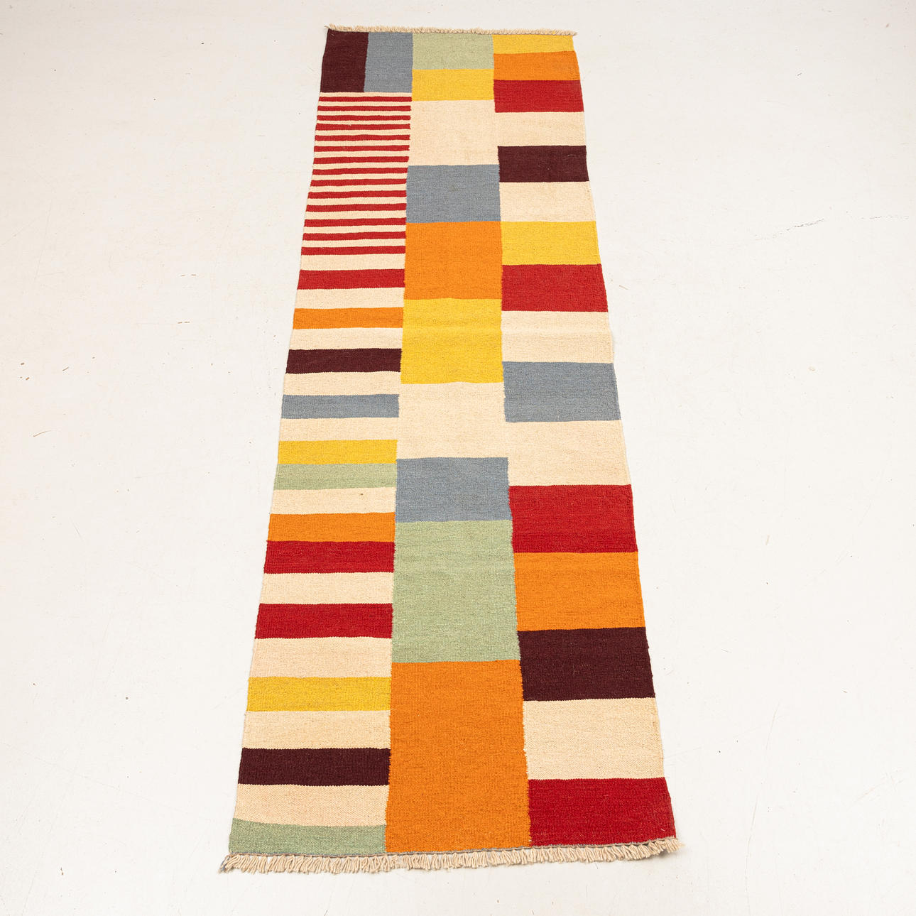 A CONTEMPORARY HANDWOVEN GALLERY CARPET.