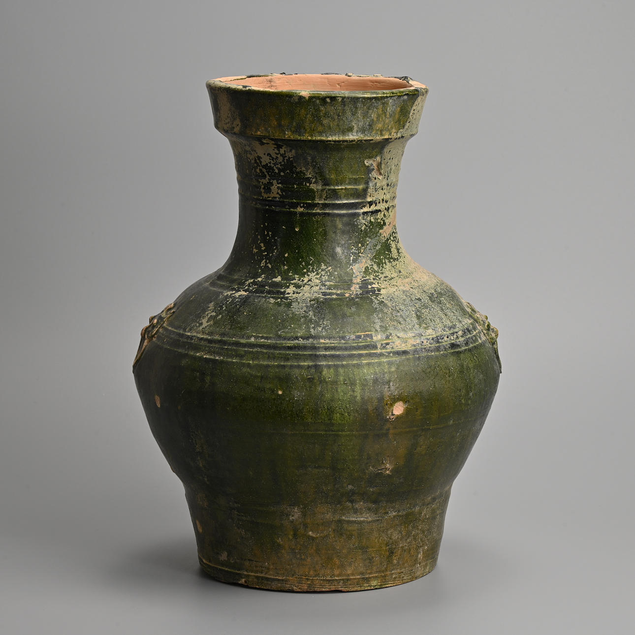 A CHINESE GREEN GLAZED POTTERY HU JAR, HAN DYNASTY (206 BC - 220