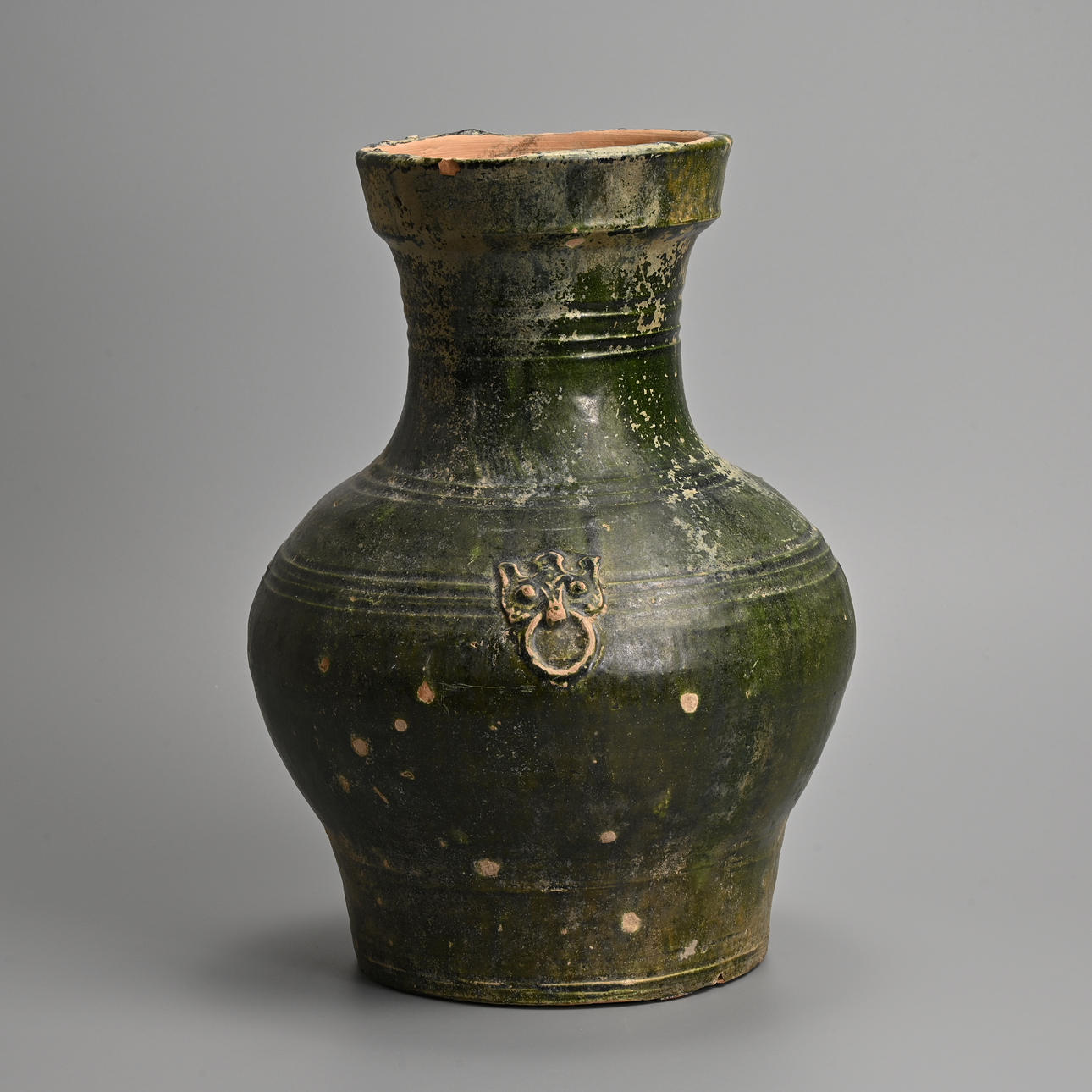 A CHINESE GREEN GLAZED POTTERY HU JAR, HAN DYNASTY (206 BC - 220