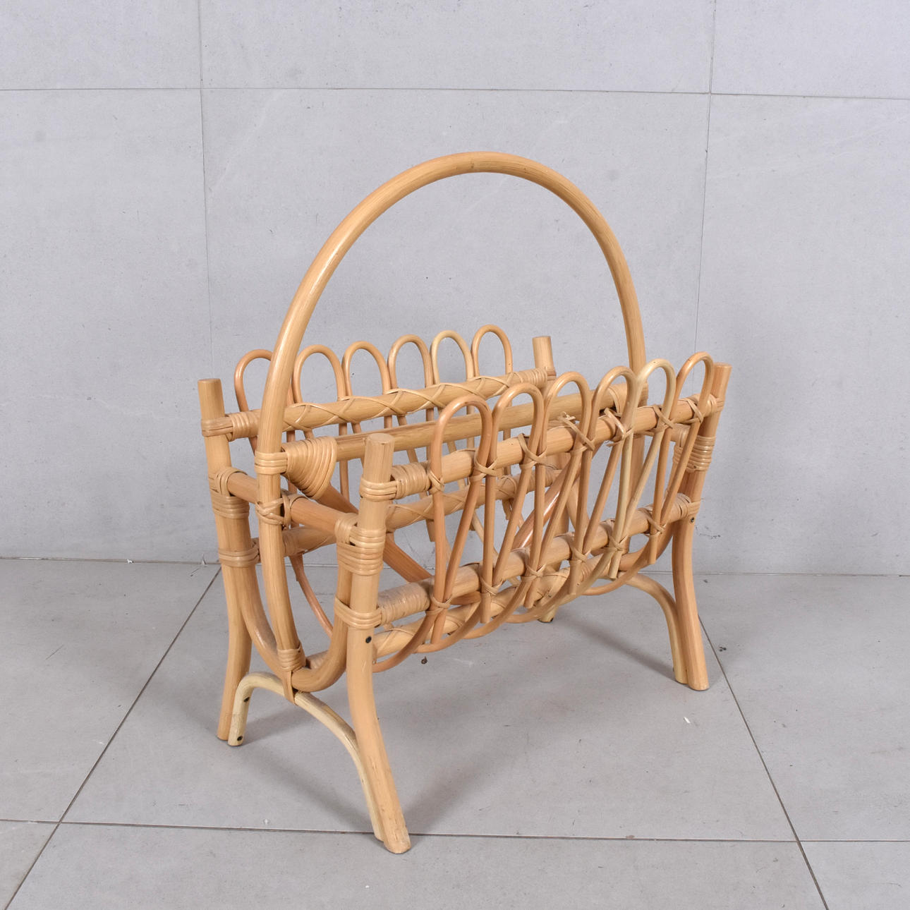 A rattan magazine rack, 20th century.