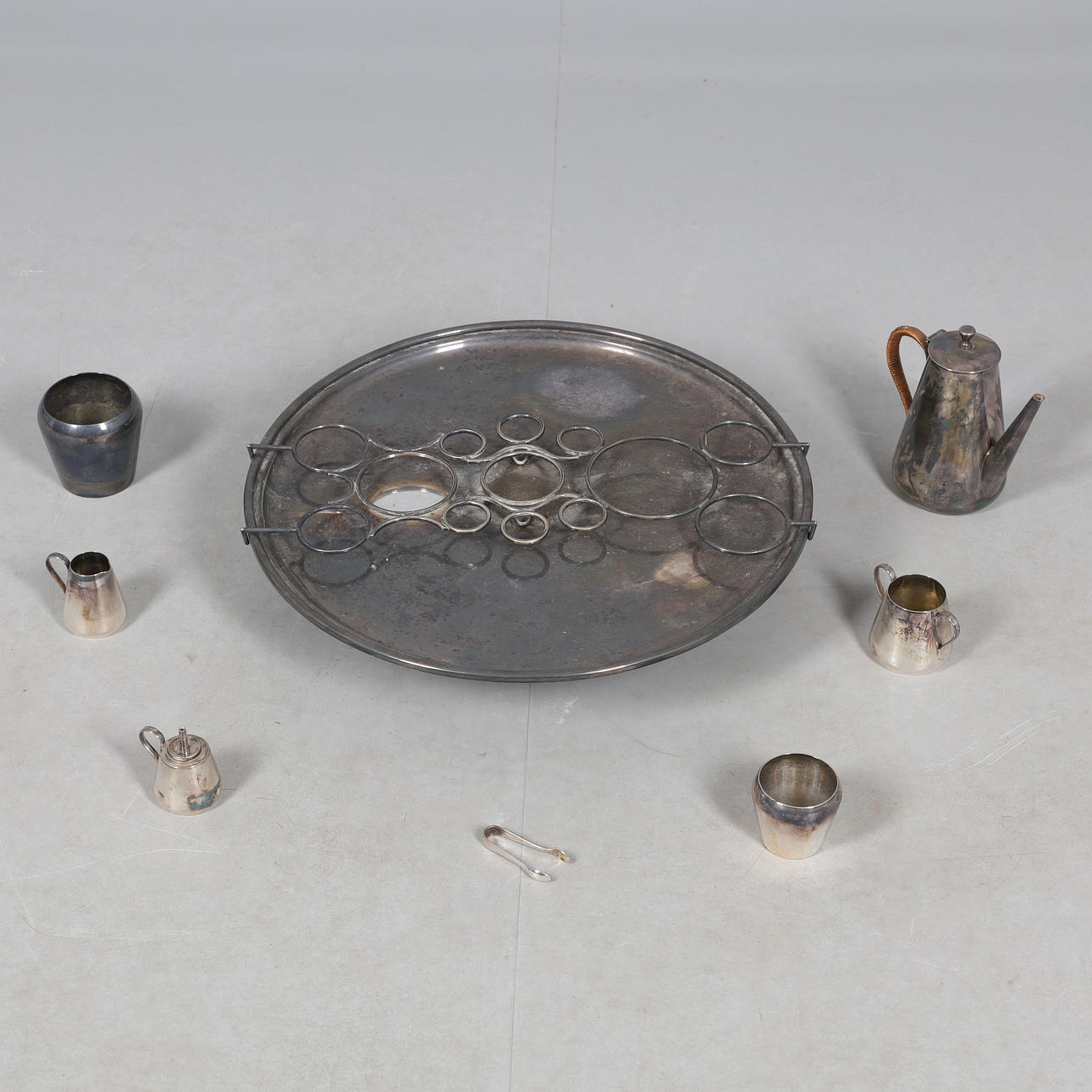 A SILVER PLATED LAZY SUSAN COFFEE SERVICE.