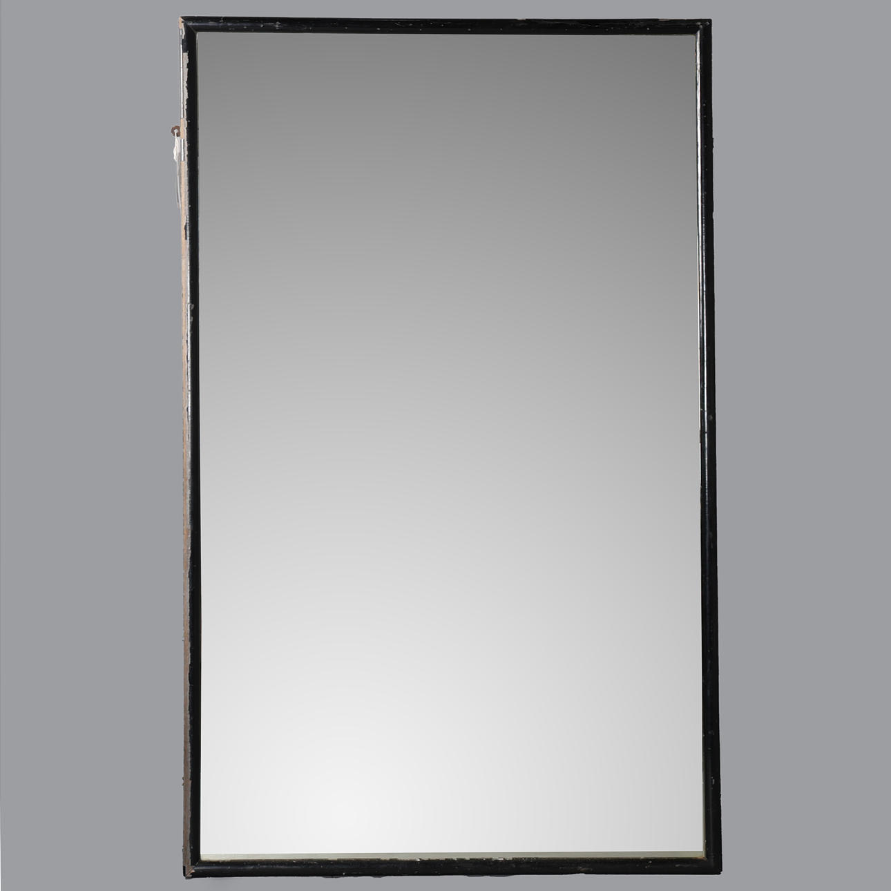 A LARGE EBONISED TAILORS MIRROR.