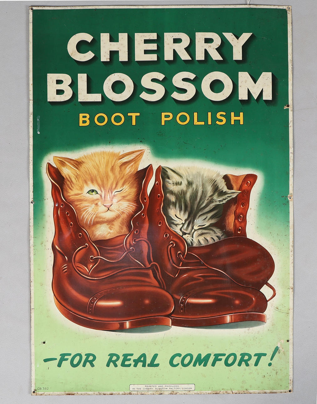 A 'CHERRY BLOSSOM BOOT POLISH' LITHOGRAPHED TINPLATE ADVERTSING SIGN.