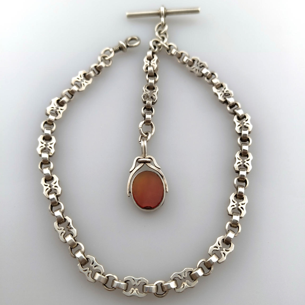 - TASKUKELLOKETJU, jossa chatelaine - hopeaketju.