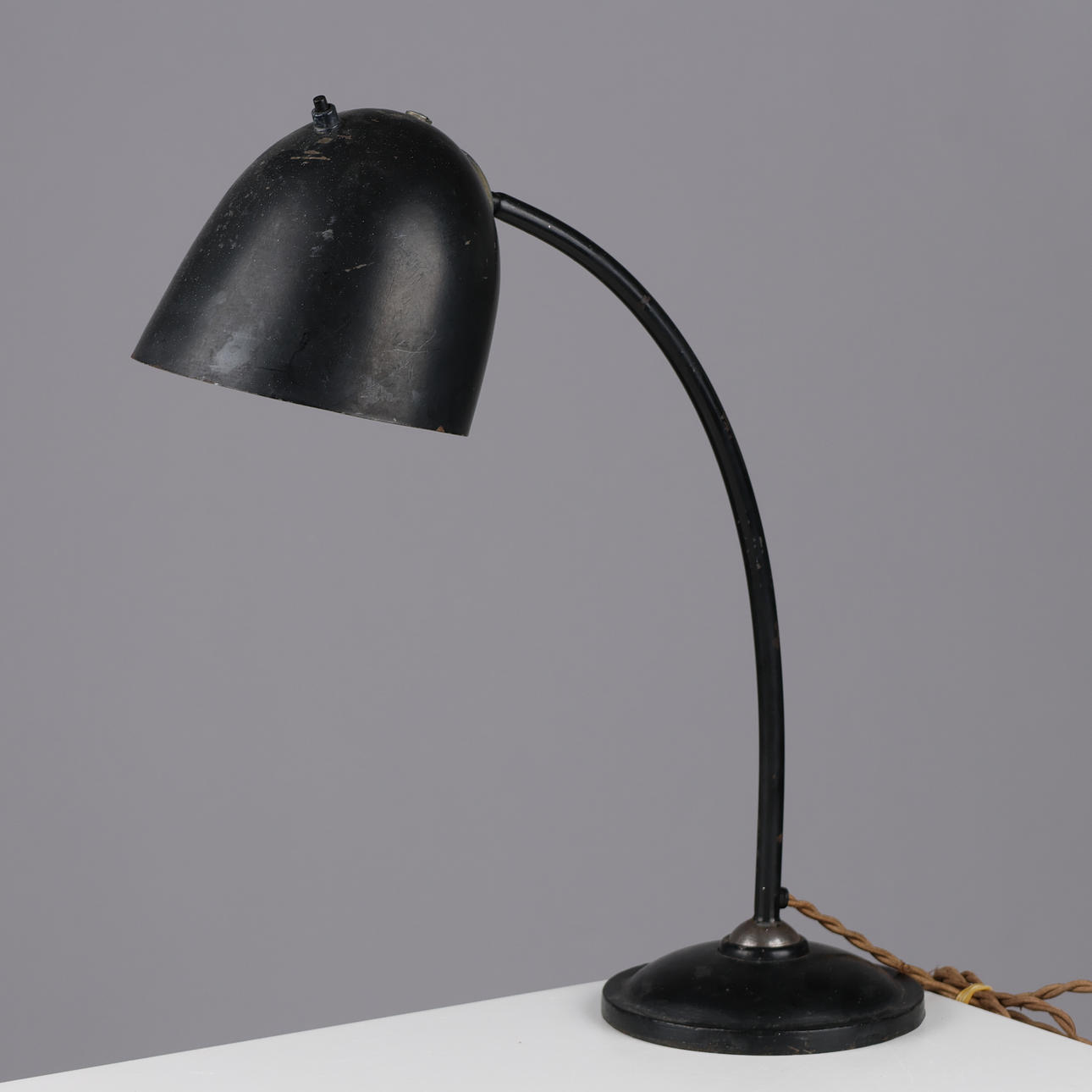 DANSK DESIGN. Adjustable table lamp made of black lacquered metal and solid iron base, Fog & Mørup, model E6333, Denmark, 1940/50s.