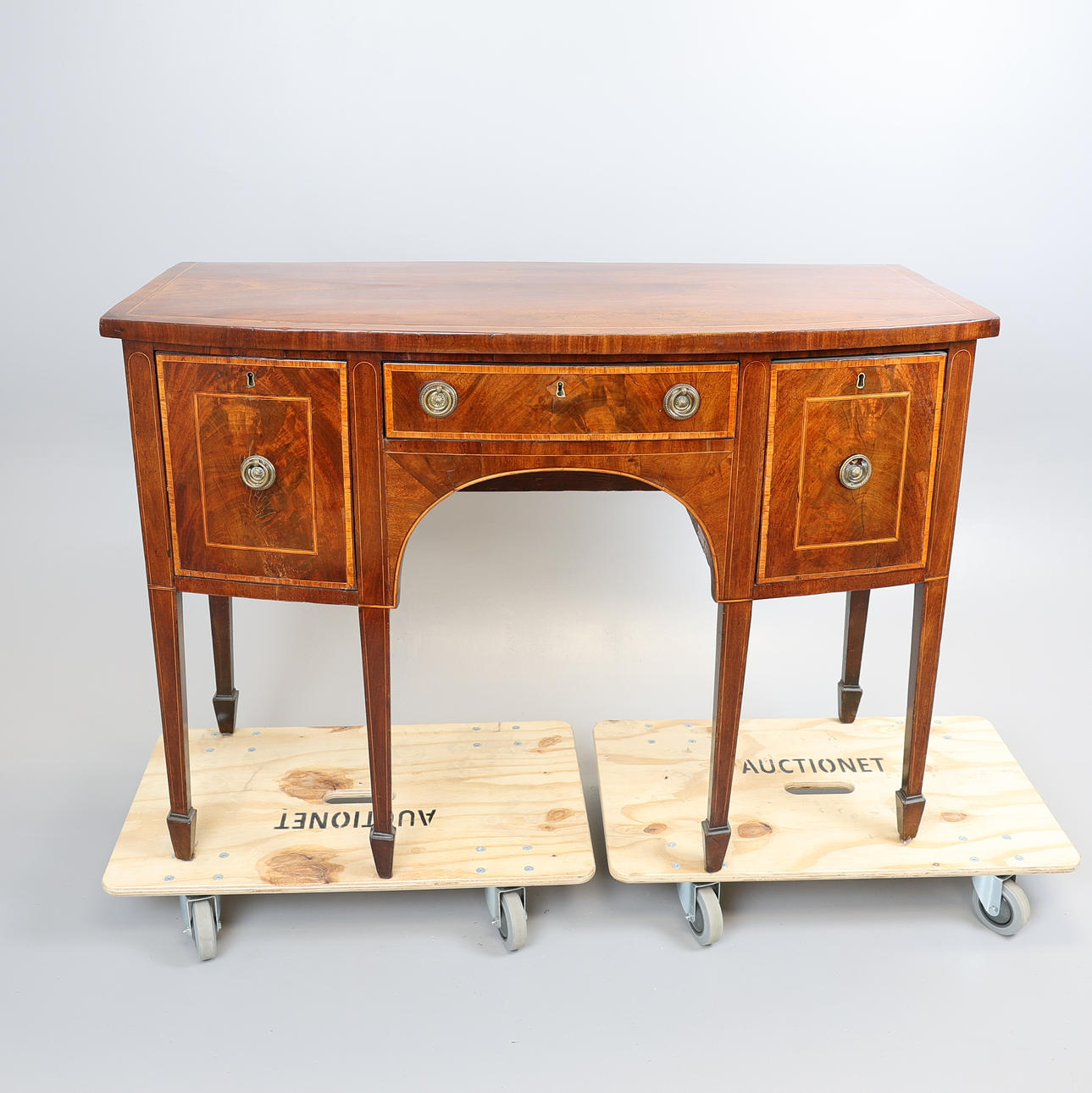 GEORGE III MAHOGANY BOW FRONTED SIDEBOARD.