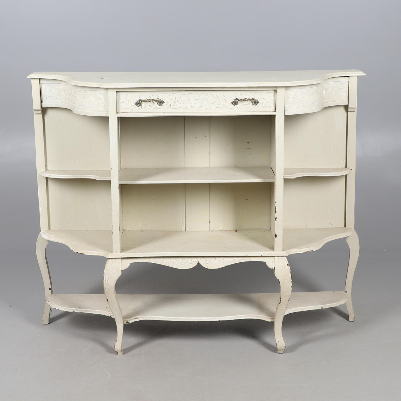 A SET OF PAINTED OPEN SHELVES.