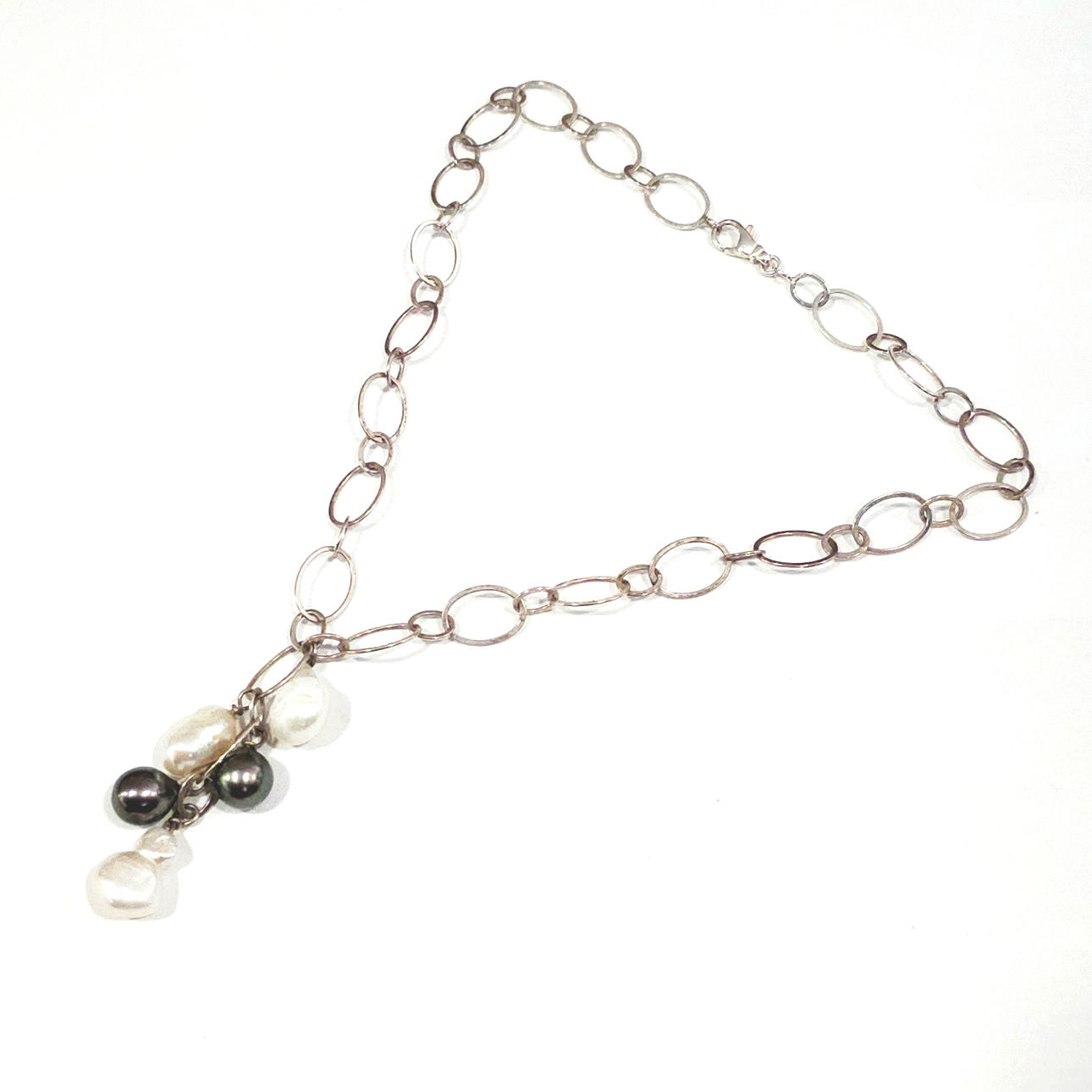 Silver necklace with baroque pearl pendants.