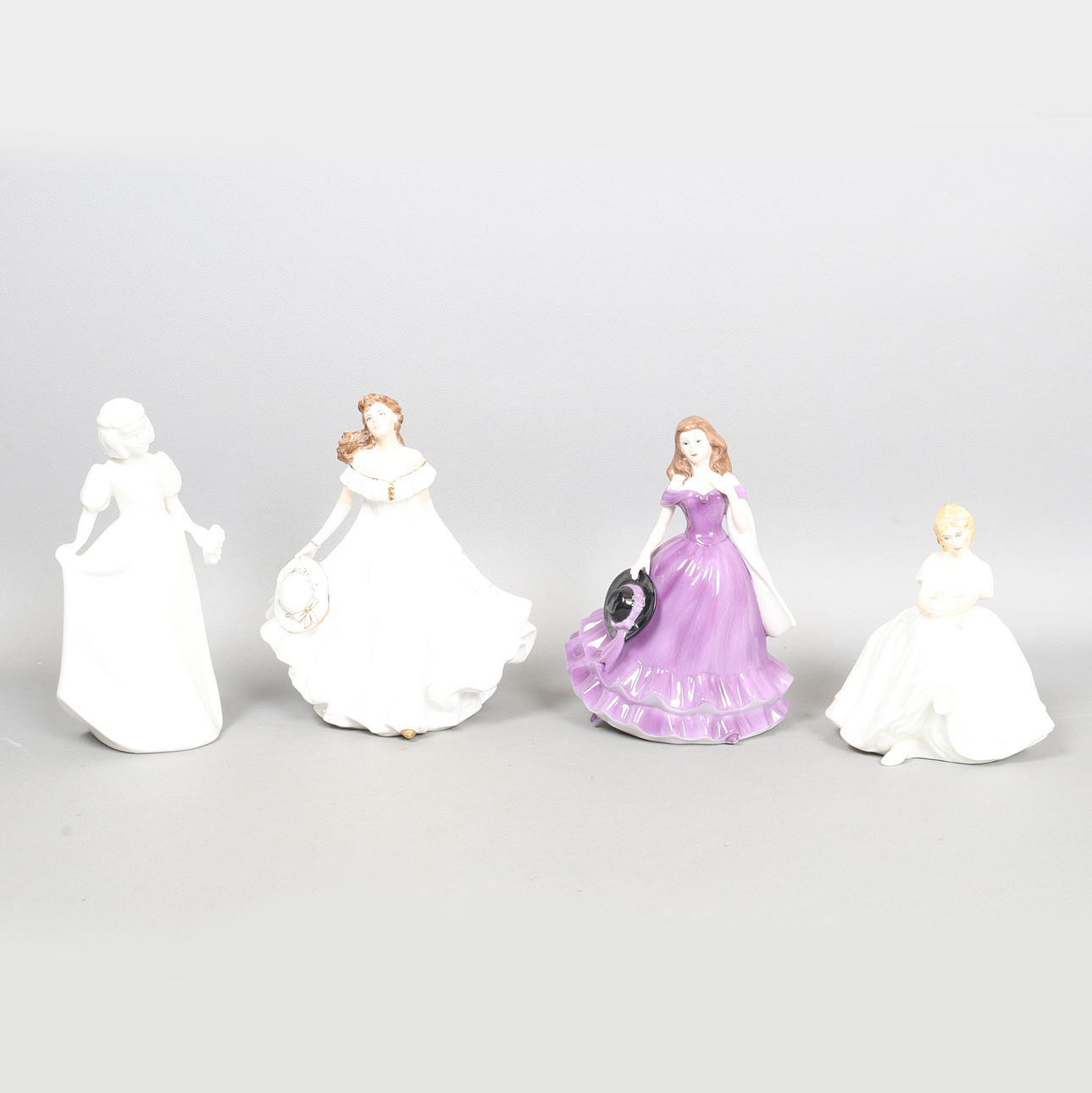 FYRA OLIKA PORSLINSFIGURER (4).