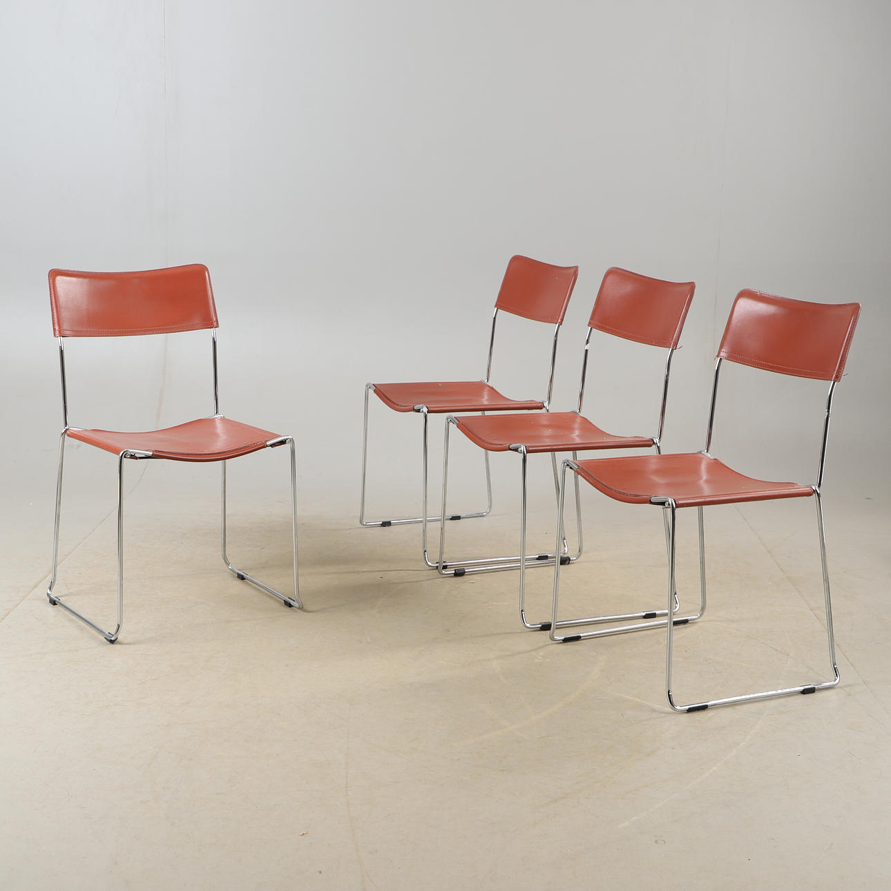 CHAIRS, 4 pieces, brown leather with steel stand, stackable.