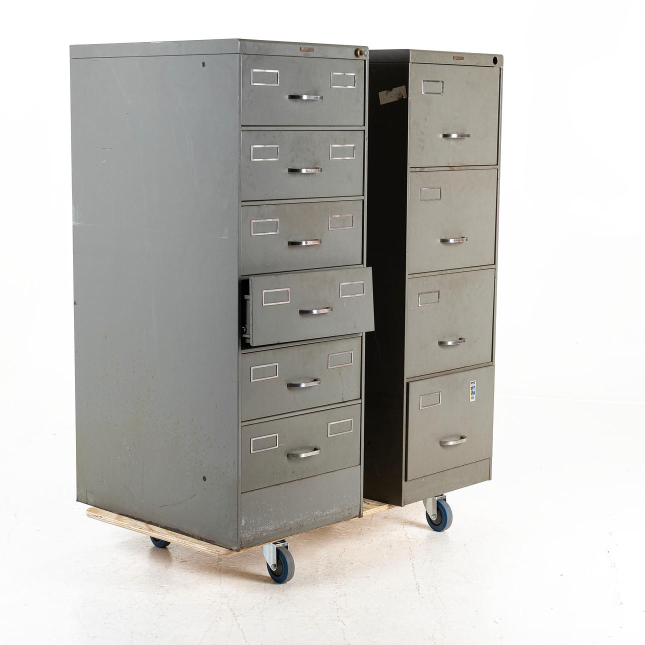 A pair of mid 1900's tin filing cabinets.