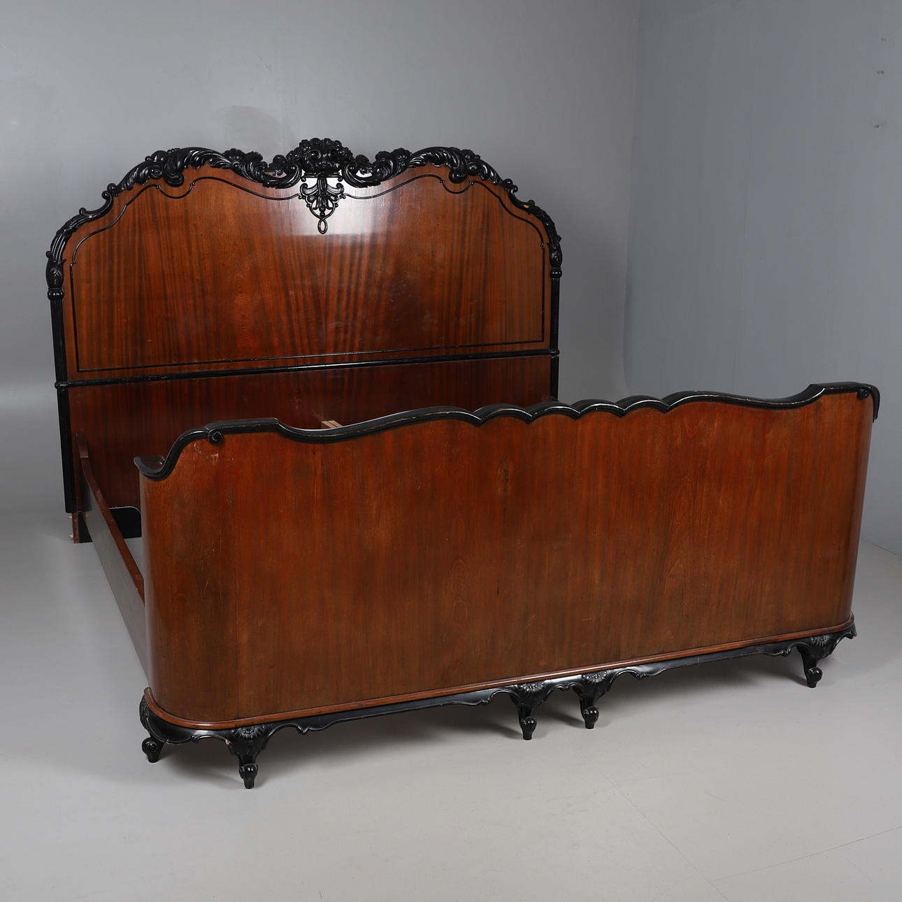 A LARGE MAHOGANY SLEIGH BED.