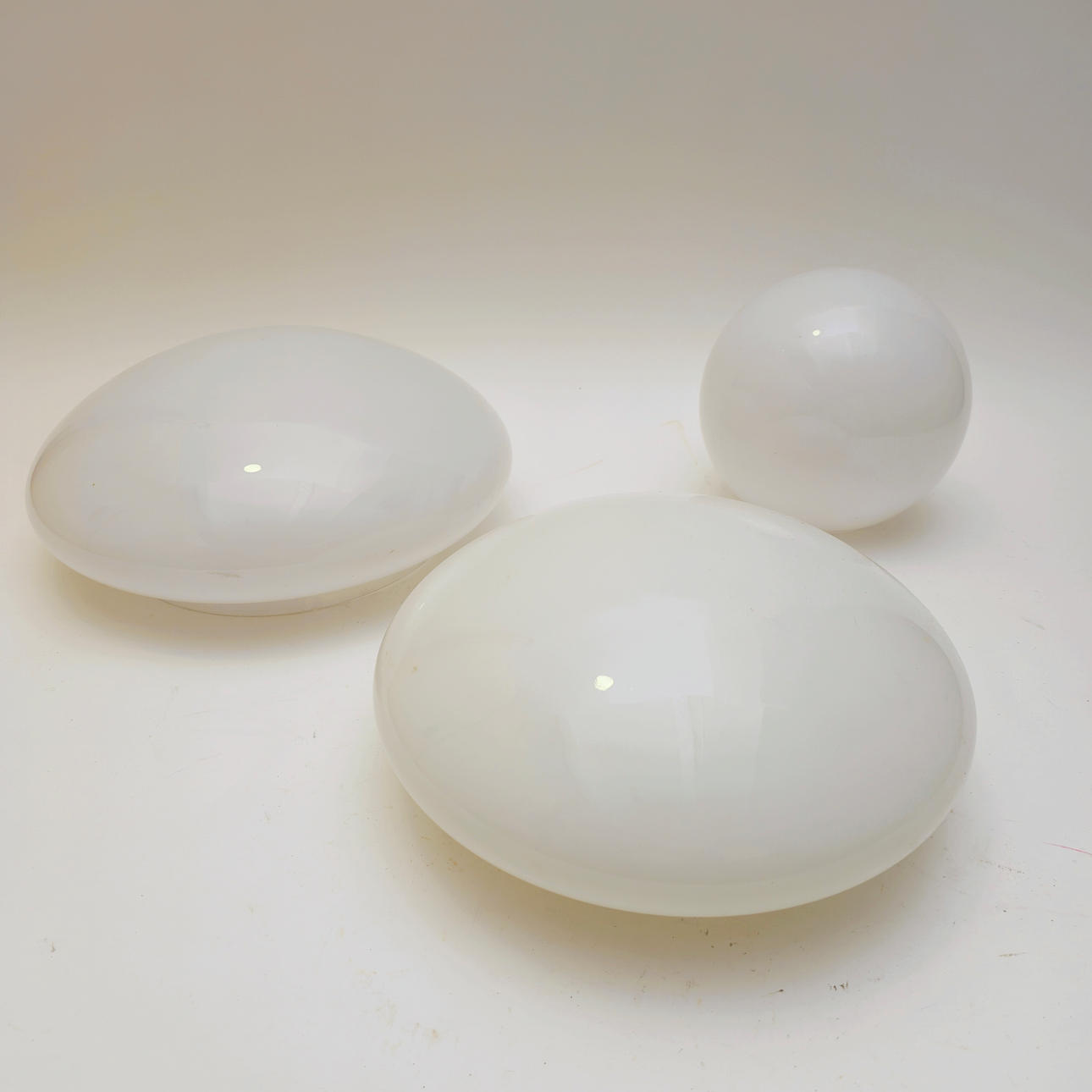 THREE OVAL AND SPHERICAL WHITE CRYSTAL TULIPS.