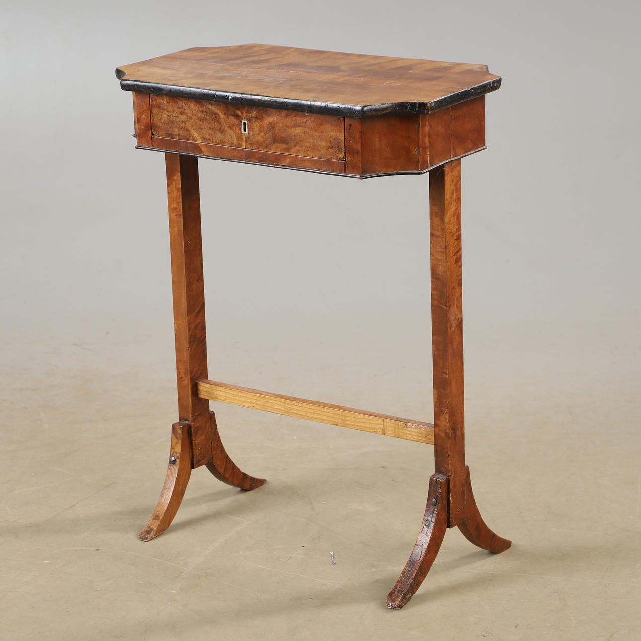 A late 19th century birch sewing table.