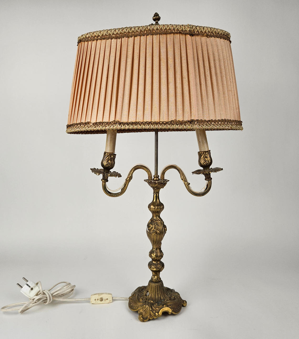 A brass table lamp, so called “Lampe à bouillotte “, Rococo style, 20th century.