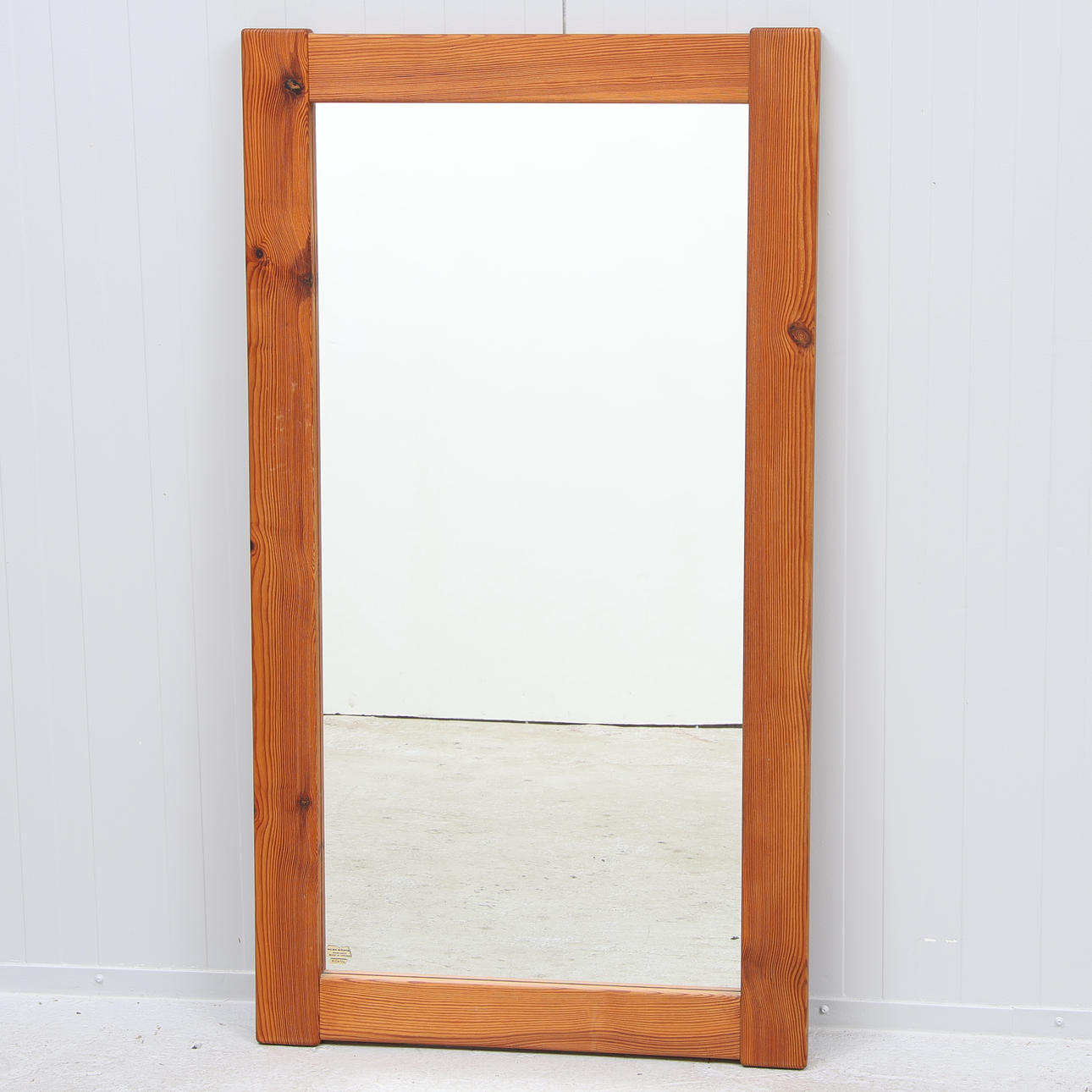 A 20th-century glass Mäster Markaryd pine mirror.