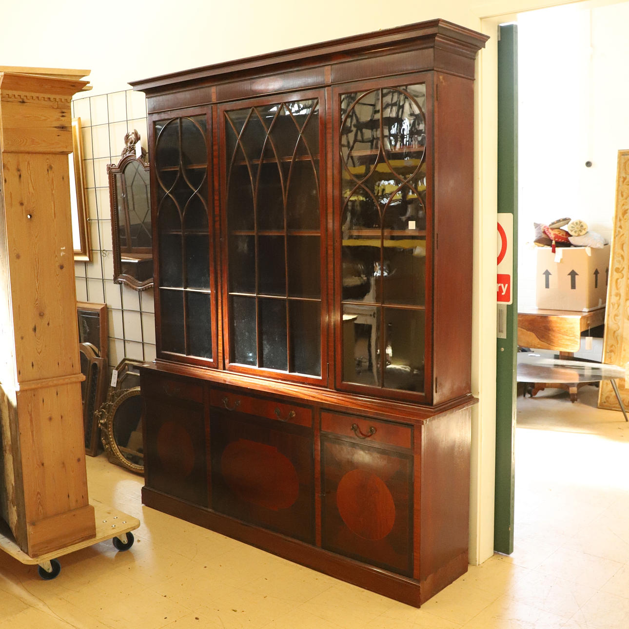 A 1920s MAPLES STYLE INLAID MAHOGANY LIBRARY BOOKCASE.