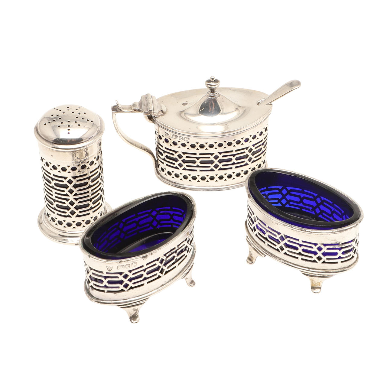 A VICTORIAN FOUR PIECE SILVER CONDIMENT SET.