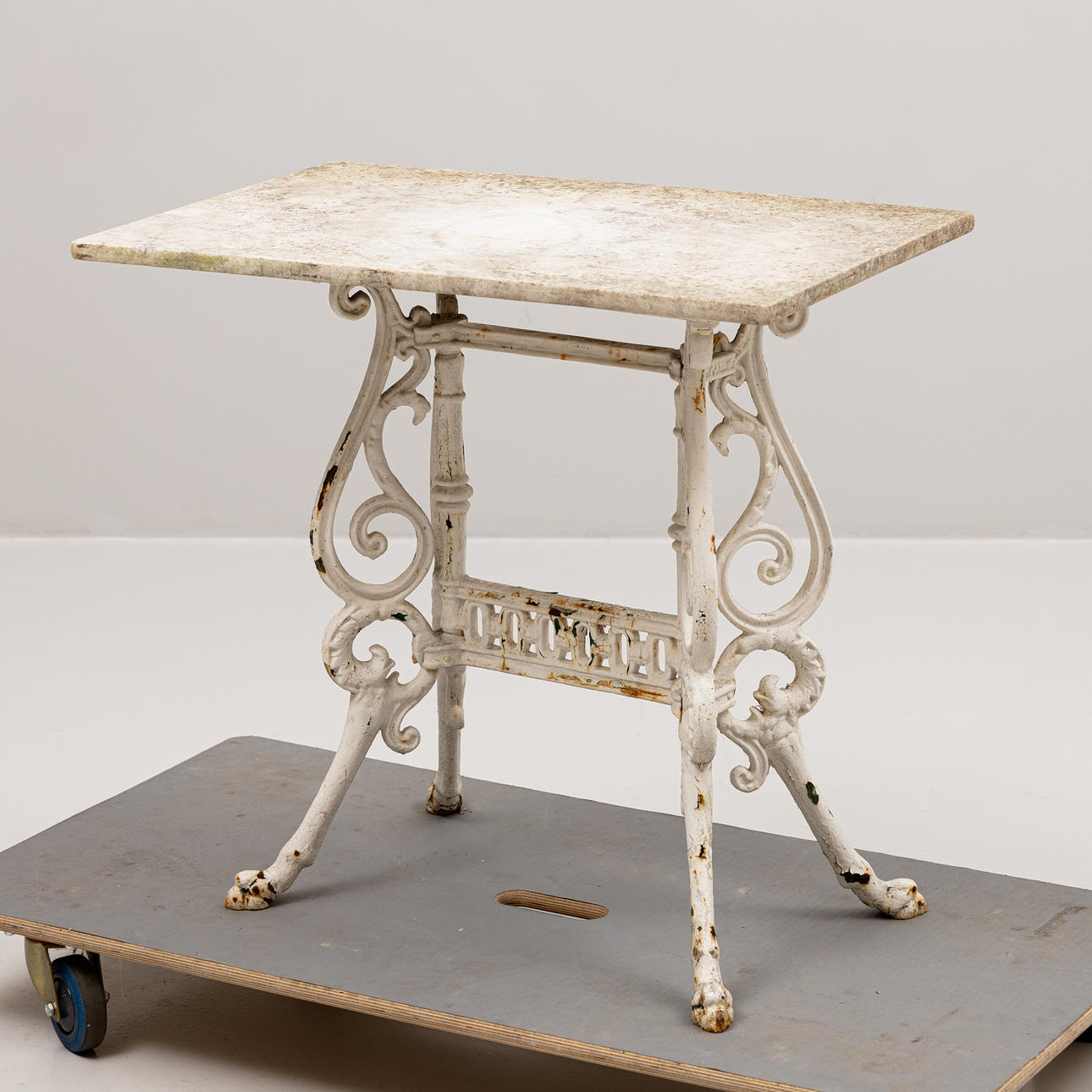 CAFEBORD, with stone top, cast iron, circa 1900.