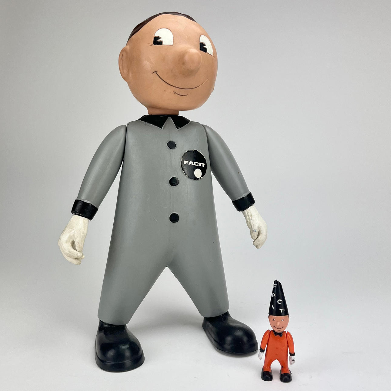 TWO PLASTIC ADVERTISING FIGURES, Facit.