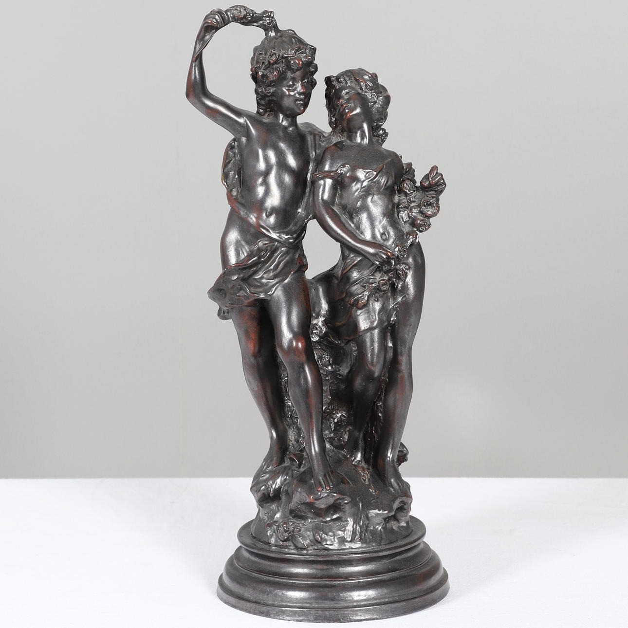 A FRENCH STYLE BRONZED FIGURAL GROUP (FORMERLY A LAMP BASE).