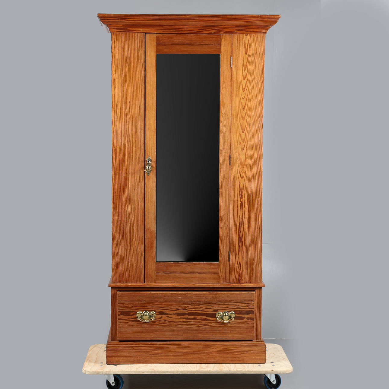 A LATE VICTORIAN PITCH PINE WARDROBE.