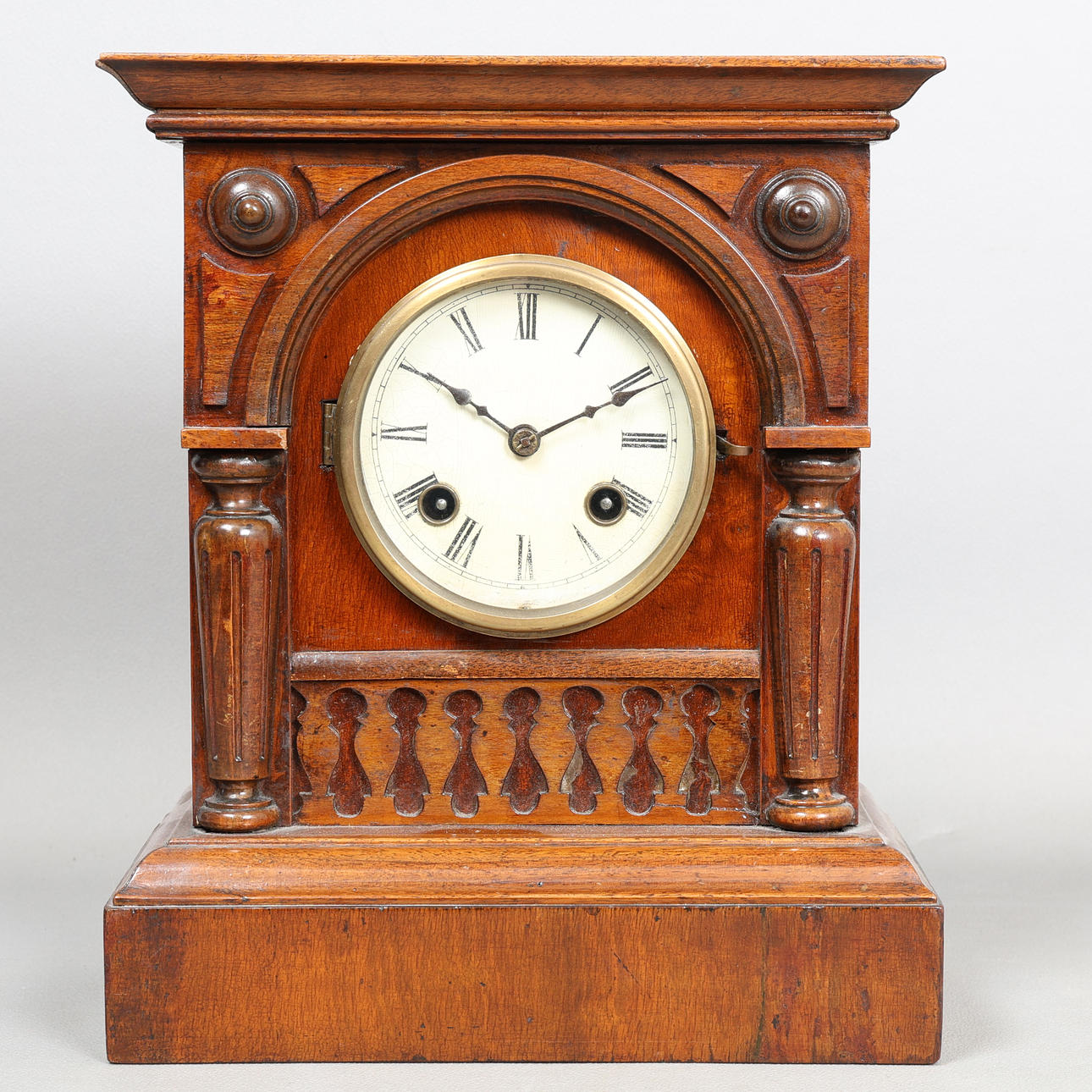 A VICTORIAN MAHOGANY CASED MANTEL CLOCK.