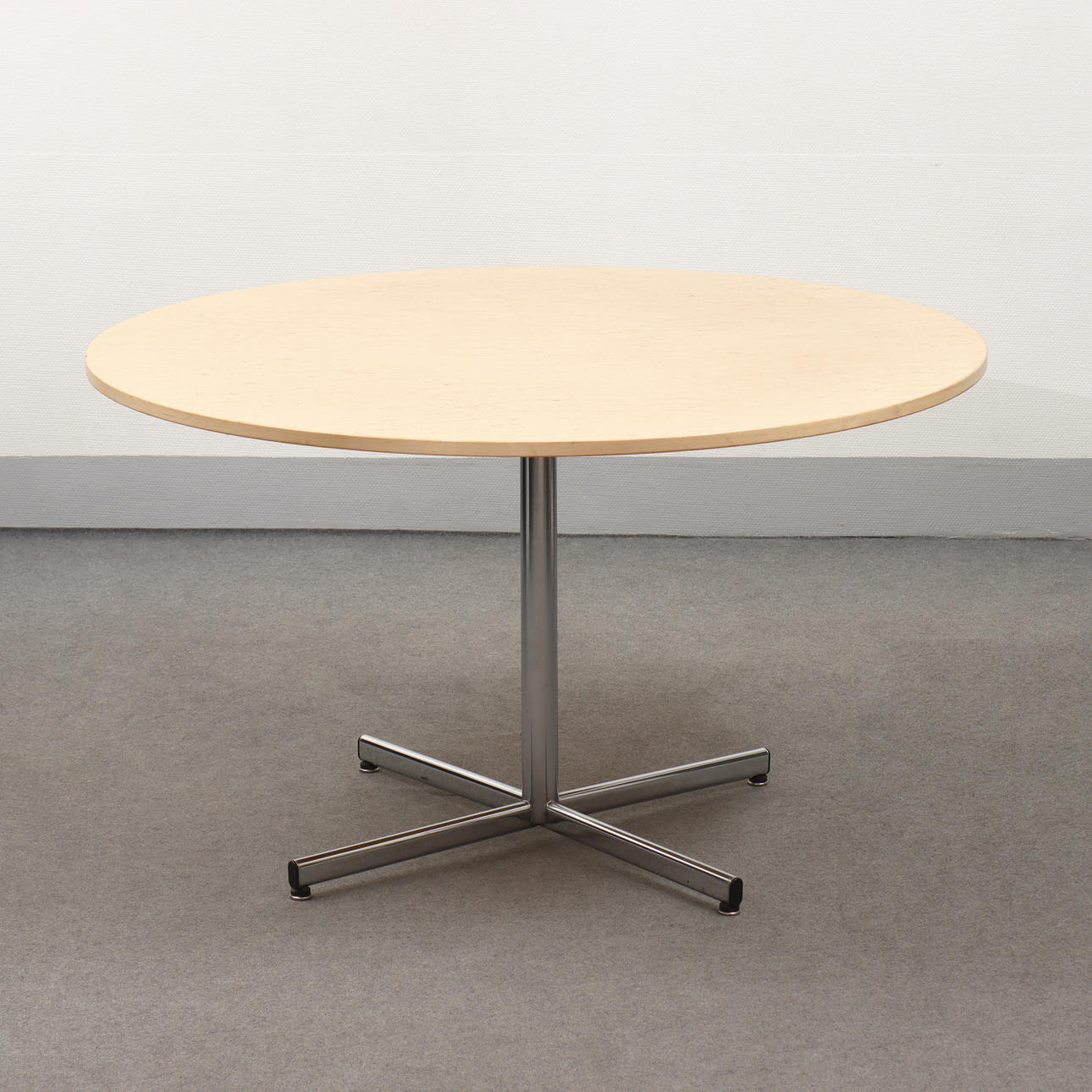 DINING TABLE IN MASUR BIRCH WITH CHROMED STAND.