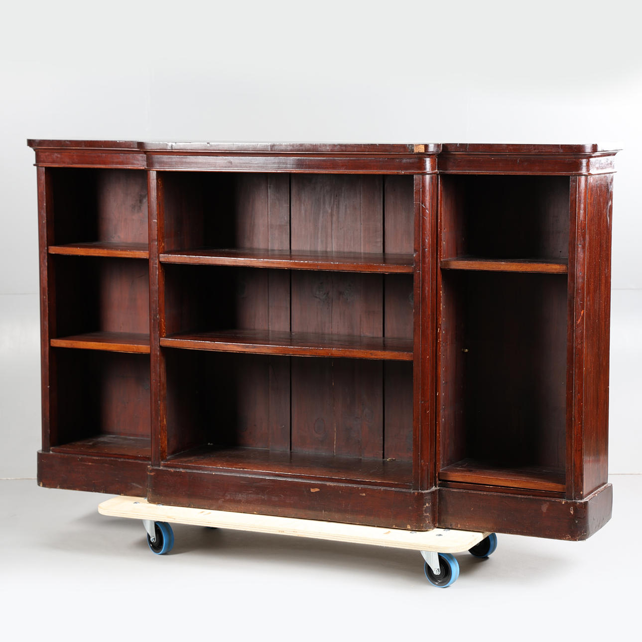 A VICTORIAN MAHOGANY BREAKFRONT LOW OPEN BOOKCASE.