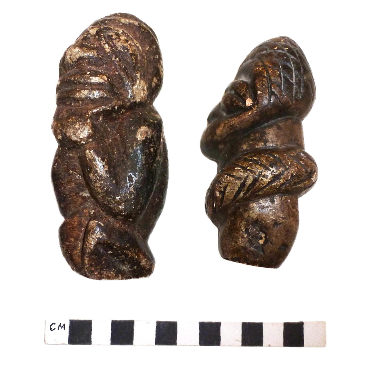 A PAIR OF CARVED STONE SAPI OR NOMOLI FIGURES, SIERRA LEONE ...
