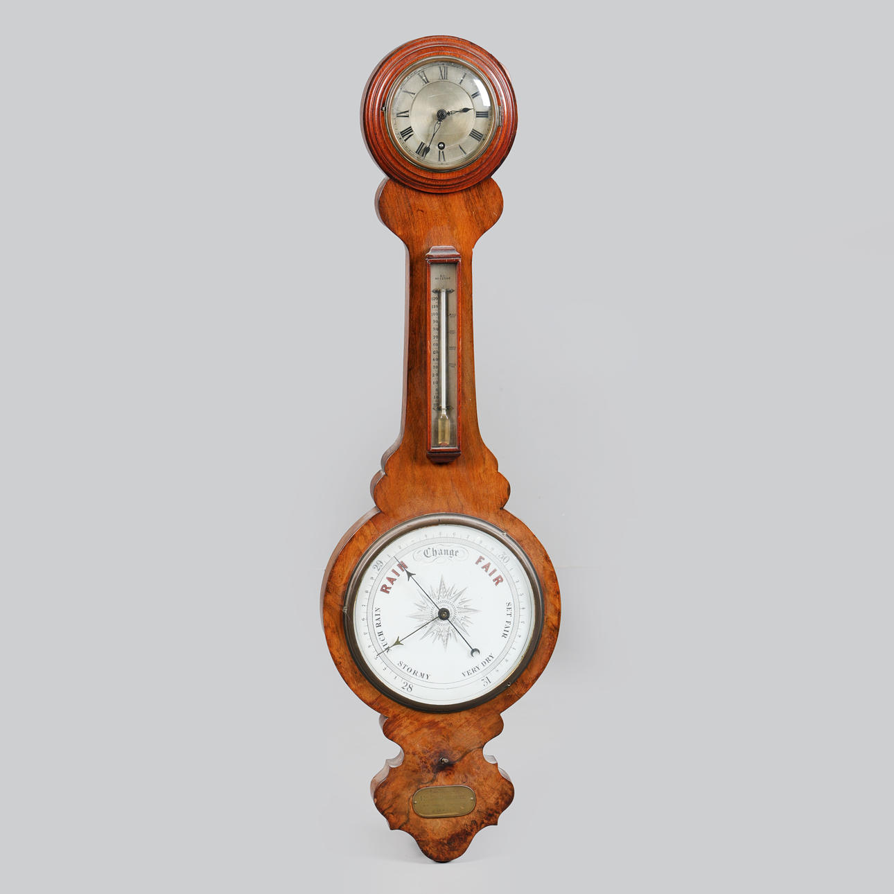 A VICTORIAN WALNUT BAROMETER.