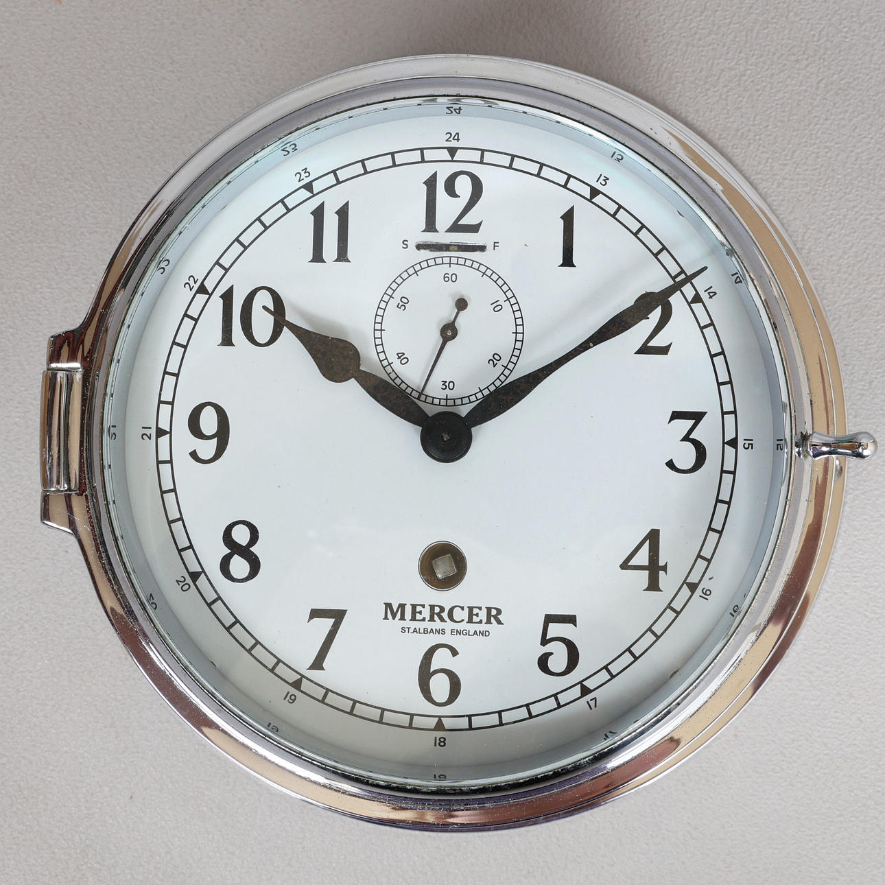 A MERCER CHROME SHIPS BULKHEAD CLOCK.