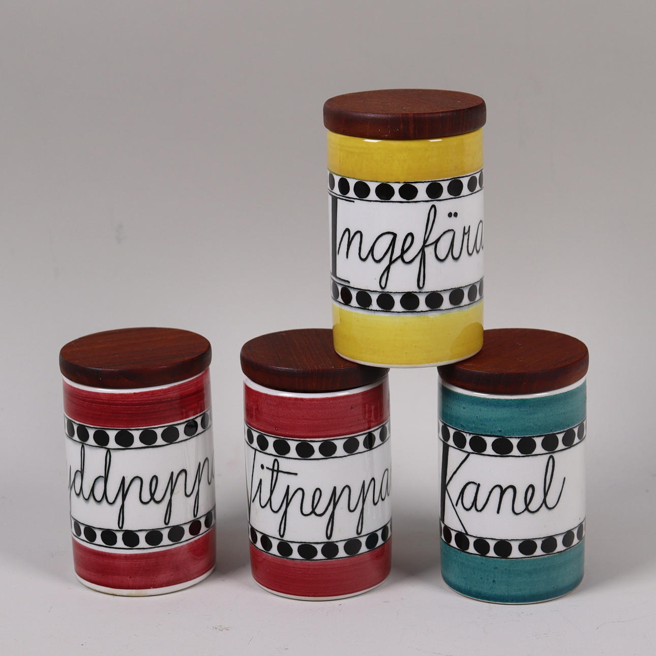 MARIANNE WESTMAN. Rörstrand, “Aroma”, flintware spice jars with teak lids.