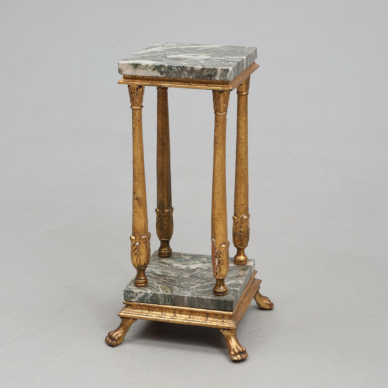 PEDESTAL, gold colored with marble panels.