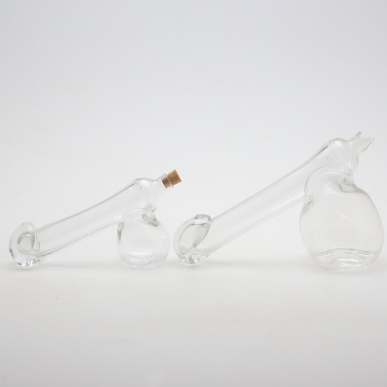 KARAFFER, 2 st, glas, fallosformade, 1900-talets andra hälft.